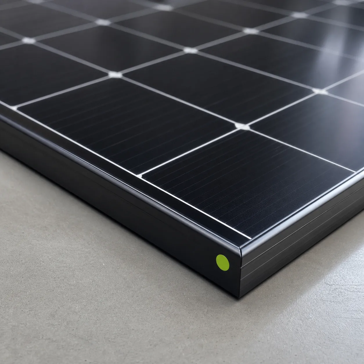 Black photovoltaic module section with tempered glass cells and a lime quality label